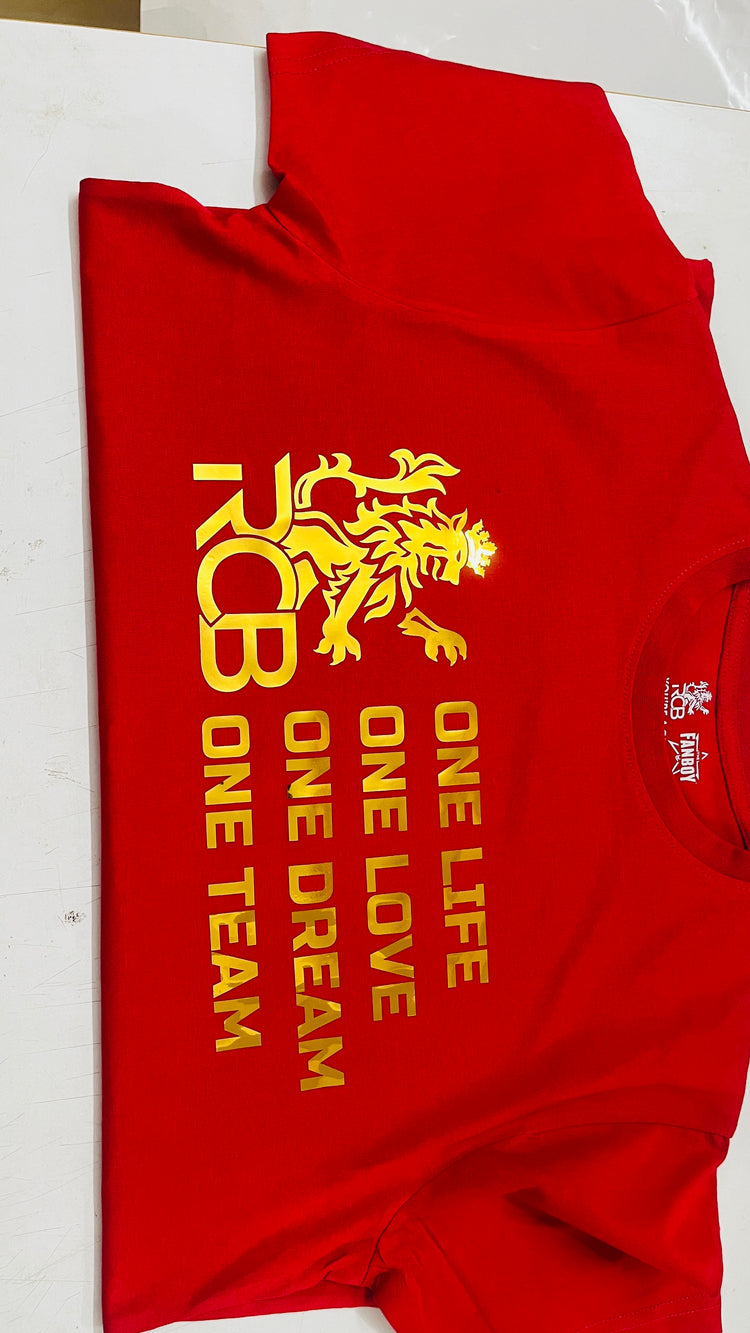 Premium RCB red and gold fan T-shirt featuring bold slogan and metallic print finish